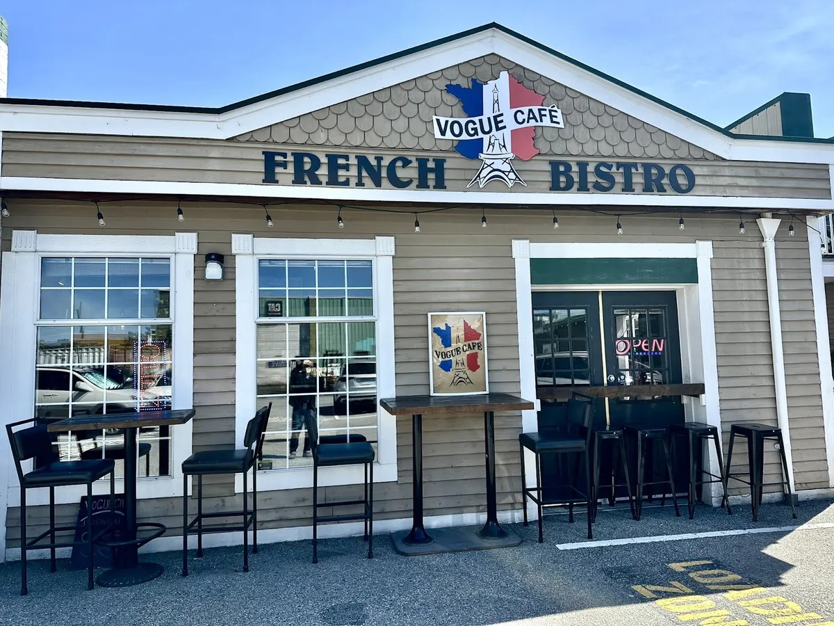 Exterior of Vogue Cafe French Bistro with outdoor seating